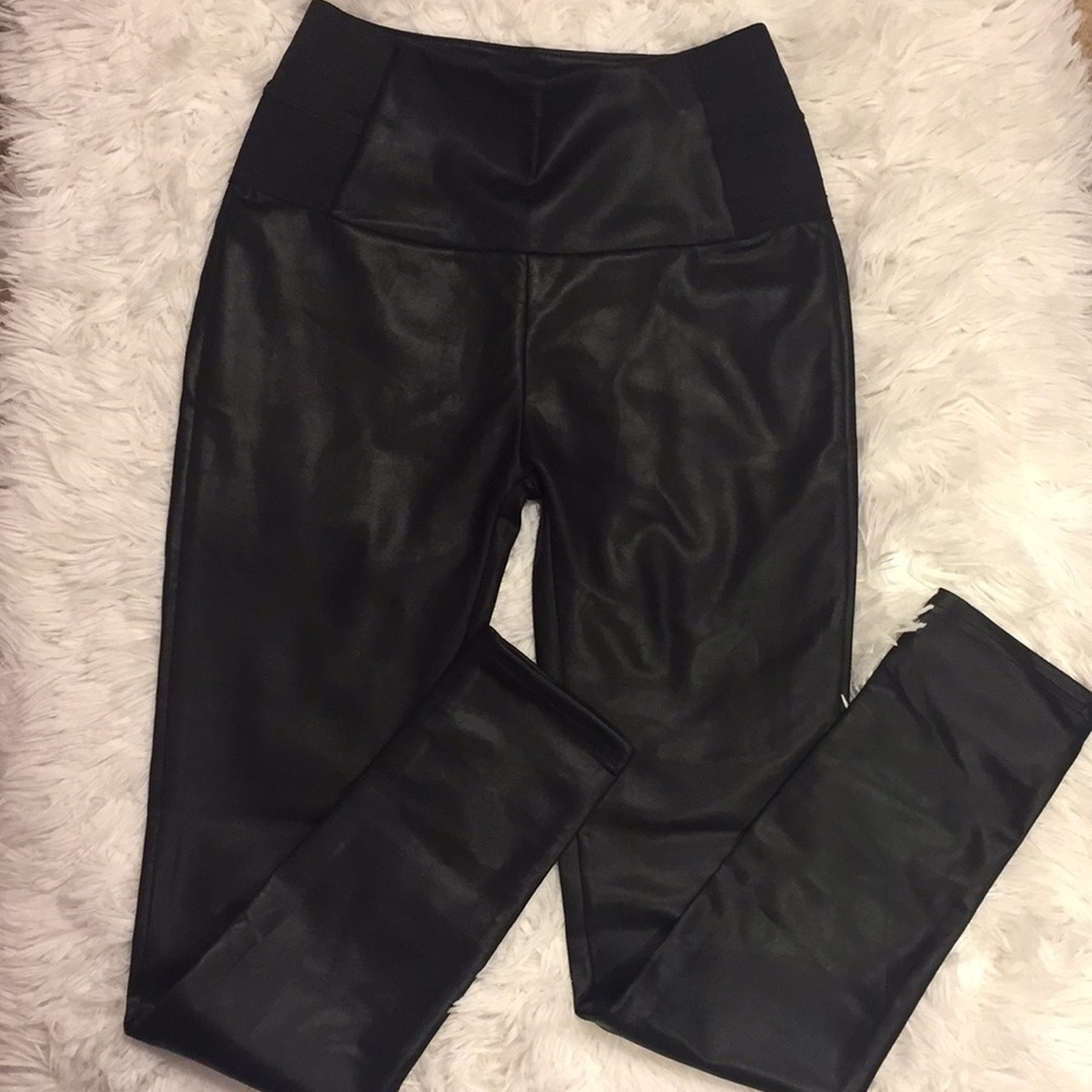 Black high rise leather leggings.